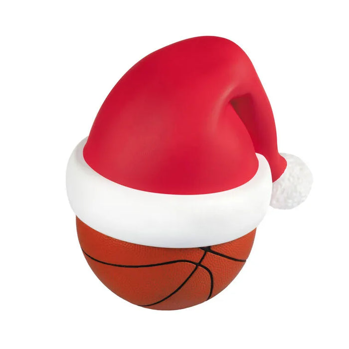 Top-down view of matte red Santa hat fitting snugly over textured orange basketball ornament