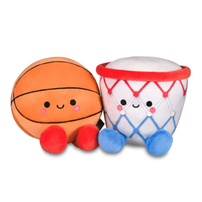 Plush toy basketball and hoop with smiling faces on a white background
