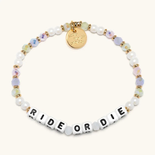 Bracelet with 'Ride or Die' beads and gold charm on a white background
