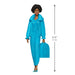 Barbie doll in a blue outfit with a suitcase, standing next to a height measurement indicator.