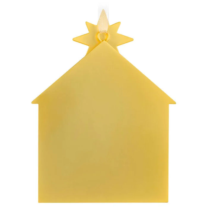 Back view of Hallmark 2026 nativity house ornament showing solid matte gold reverse side and hanging loop