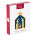 Front retail box for Hallmark 2026 God So Loved the World nativity ornament featuring red banner and 2026 badge