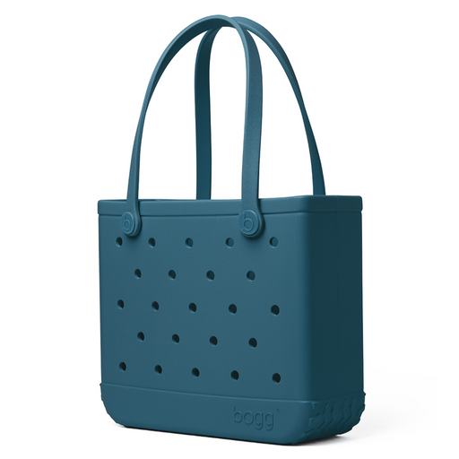 Baby Bogg Bag in Blue Lagoon – small waterproof tote bag in solid teal blue with perforated sides and double handles, perfect for beach or travel.