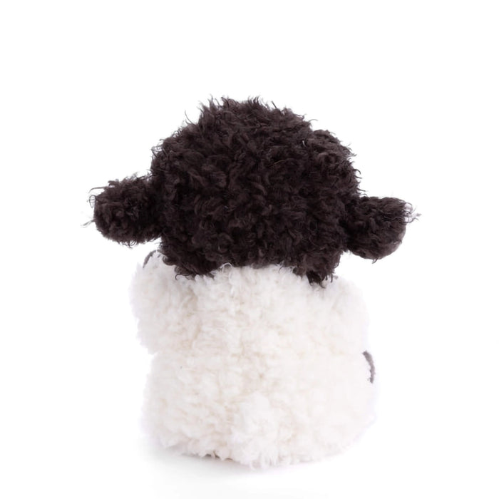 Back view of Bukowski Black Sheep plush showing soft white fleece body and curly black head