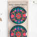 Two car magnets featuring vibrant floral designs in various colors and patterns.