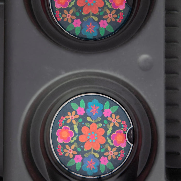 Two decorative car magnets adorned with colorful floral patterns.