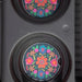 Two decorative car magnets adorned with colorful floral patterns.