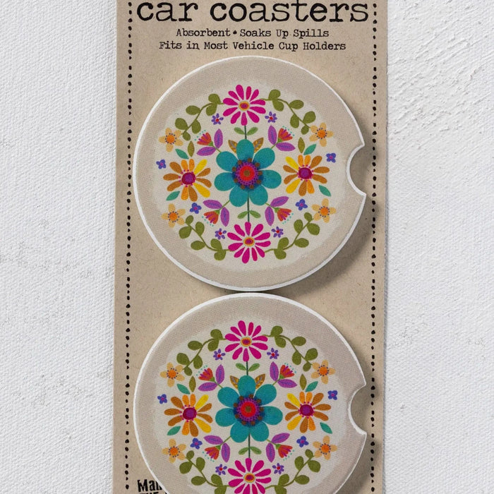 Two car coasters featuring vibrant, colorful flowers on a light background.
