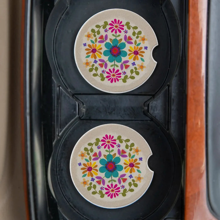 Two decorative car coasters showcasing an array of colorful flowers.
