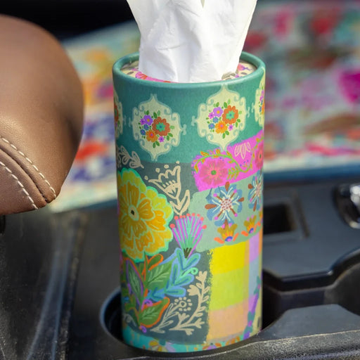 A tissue holder placed on the dashboard of a car, adding convenience to the vehicle's interior.