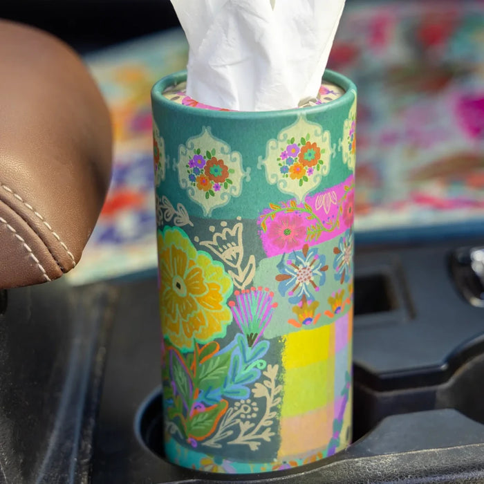 A tissue holder placed on the dashboard of a car, adding convenience to the vehicle's interior.