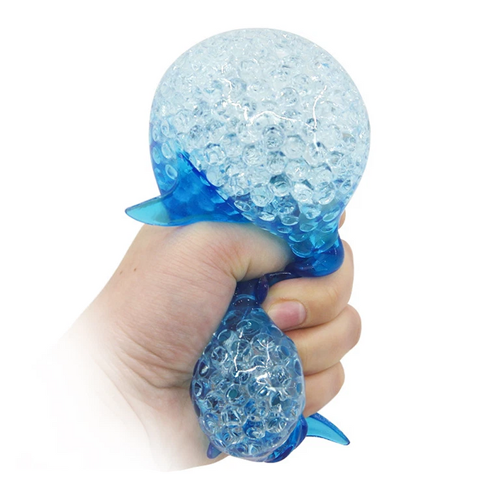 Hand holding a blue textured ball against a white background