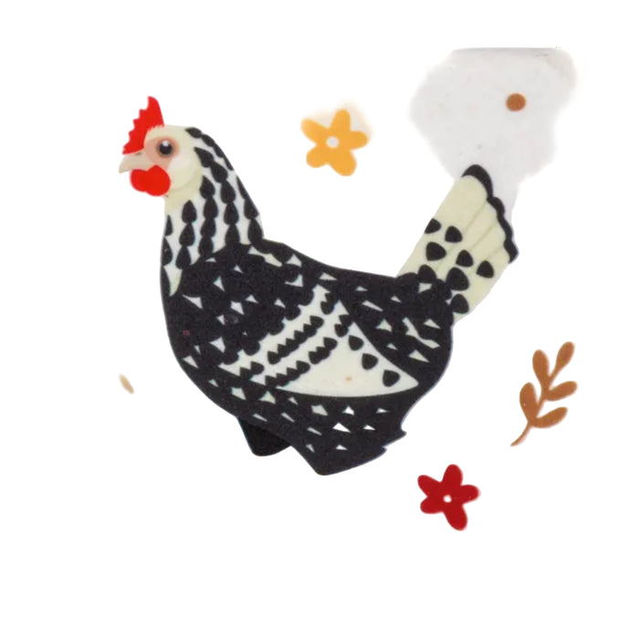 Decorative chicken figure with black and white pattern on a white background