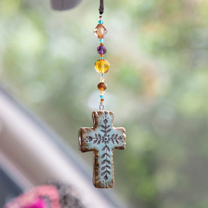 Natural Life Artisan Cross Car Charm featuring an artisan-inspired cross design