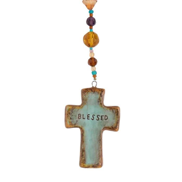 Natural Life Artisan Cross Car Charm featuring an artisan-inspired cross design