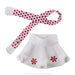 White skirt with red snowflake design and red polka dot headband on a white background