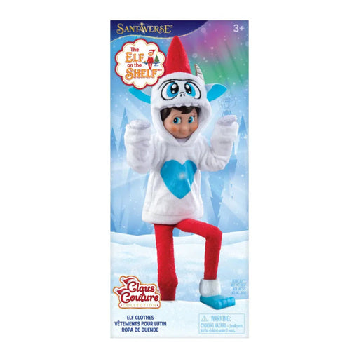 Toy Elf on the Shelf  in Yeti costume with blue heart on hoofie , featuring Sant'averse branding.