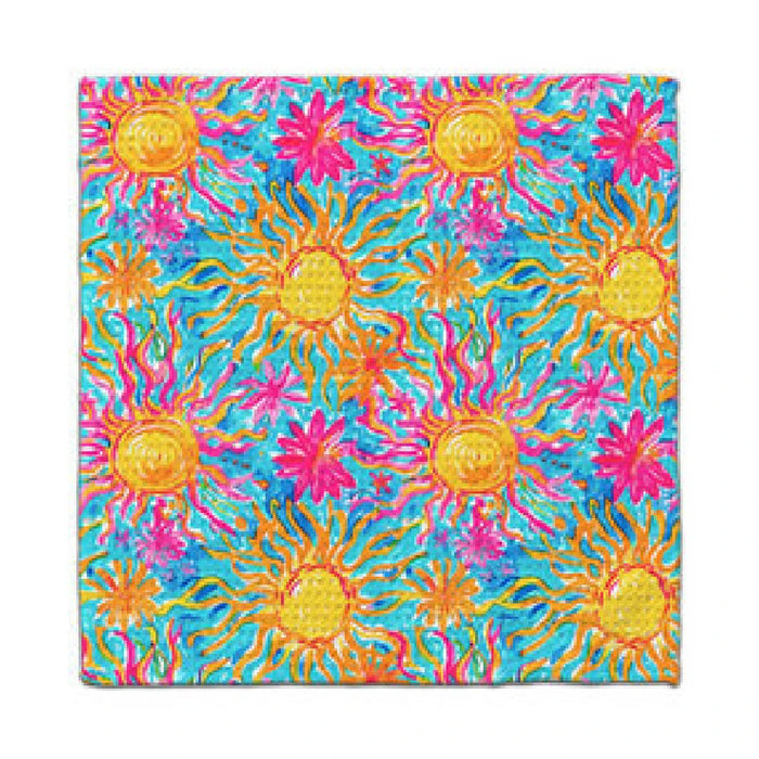 A vibrant sun print displayed on a blue and yellow towel, showcasing a cheerful summer theme.