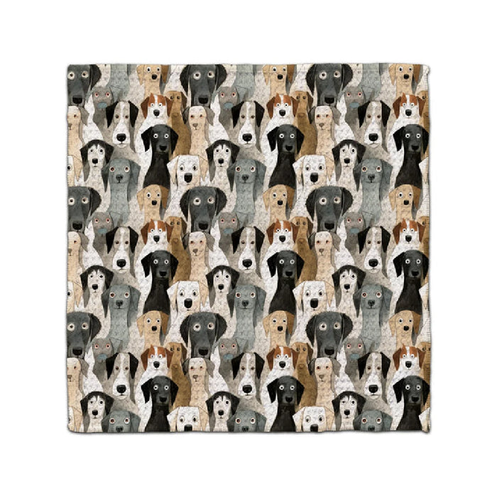 A cozy blanket featuring various dog breeds in a colorful pattern, showcasing their unique shapes and expressions.

