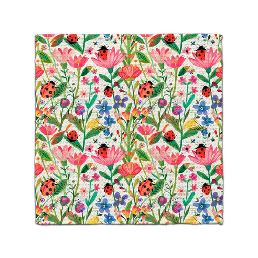 A lively floral design with an array of colorful flowers and playful ladybugs among the blooms.