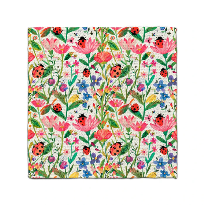 A lively floral design with an array of colorful flowers and playful ladybugs among the blooms.