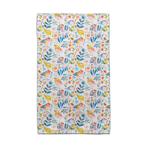 A bright towel displaying a floral pattern, complete with colorful birds and leaves, perfect for adding charm to any space.
