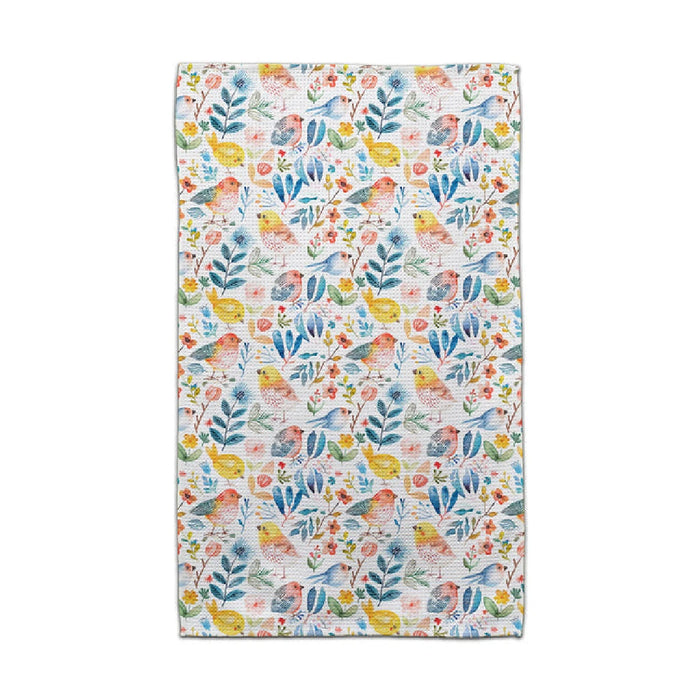 A bright towel displaying a floral pattern, complete with colorful birds and leaves, perfect for adding charm to any space.