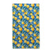 A towel featuring a pattern of lemons and green leaves on a light background.
