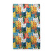 A blue towel adorned with a playful, colorful cat design.