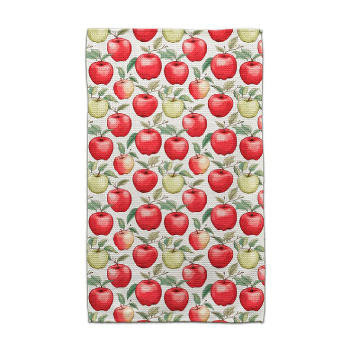 2. A decorative towel adorned with various apples arranged on it.
