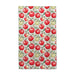 2. A decorative towel adorned with various apples arranged on it.
