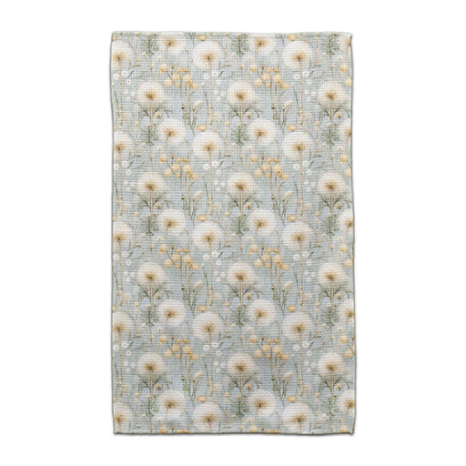 A blue and white floral print blanket draped elegantly, showcasing intricate flower patterns on a soft fabric.