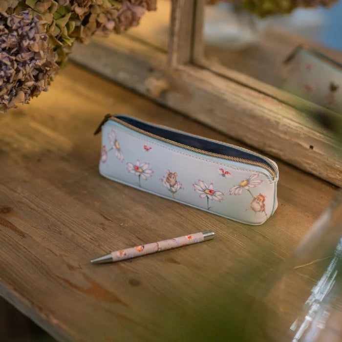 A pencil case showcasing a decorative flower motif.