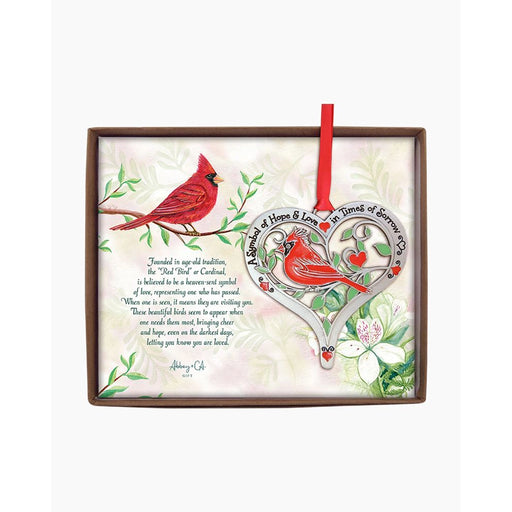 Decorative wall art with red cardinals and a heart-shaped design on a light background.