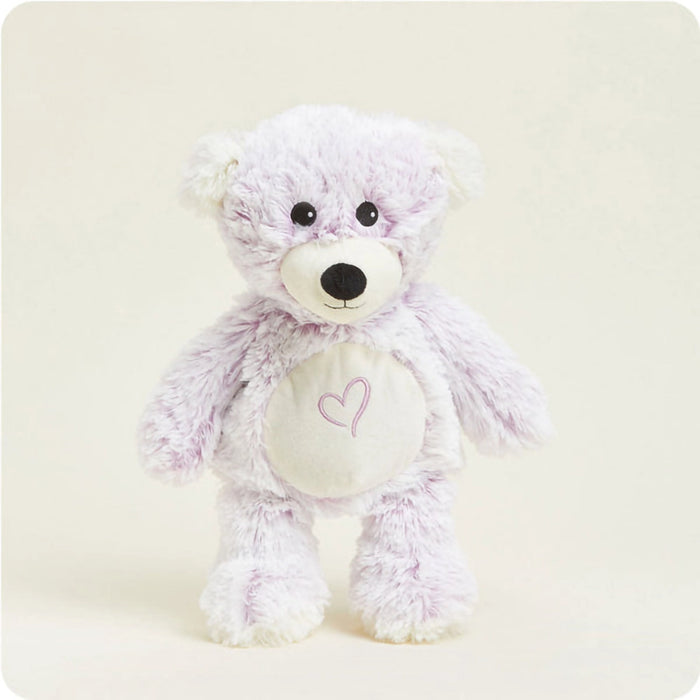 Full view of Warmies Love Bear Plush standing upright with embroidered heart detail on the belly