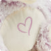 Close-up of embroidered heart on Warmies Love Bear Plush belly, symbolizing love and comfort