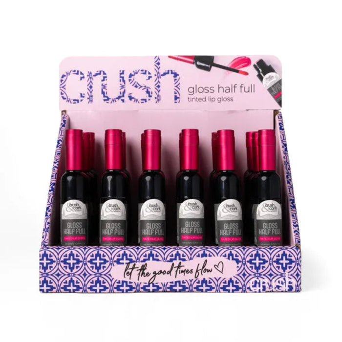 The Crush Crush & Cork Winery Gloss Half Full Tinted Lip Gloss delivers a glossy, ruby-colored finish that catches every light.