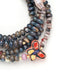 Scout Curated Wears ceramic bead wrap bracelet/necklace with multicolored beads and butterfly charm on Transformation card.