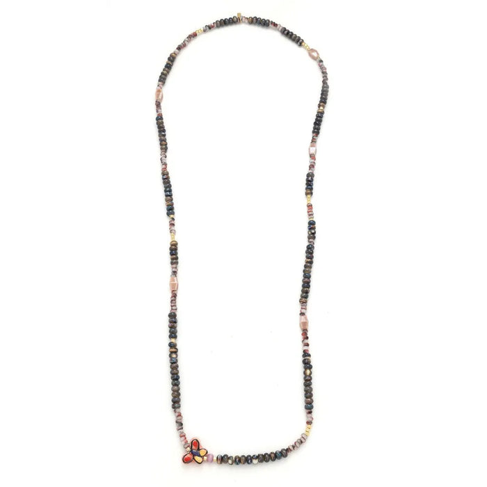Scout Curated Wears ceramic bead wrap bracelet/necklace with multicolored beads and butterfly charm on Transformation card.