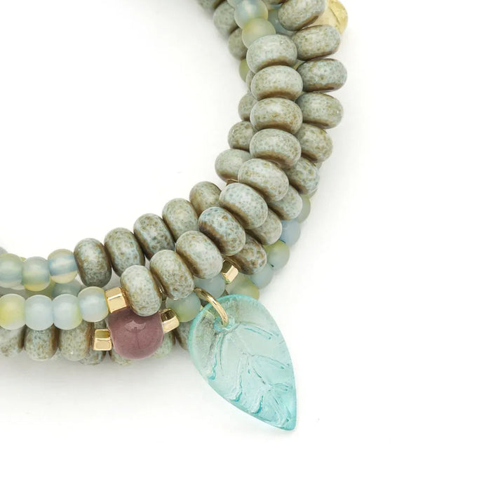 Scout Curated Wears Renewal/Leaf ceramic bead wrap bracelet/necklace with pale green beads and a mint leaf charm.