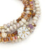 Scout Abundance/Sun ceramic bead wrap bracelet/necklace with cream, pink, amber, and lavender beads and a gold-tone sun motif.