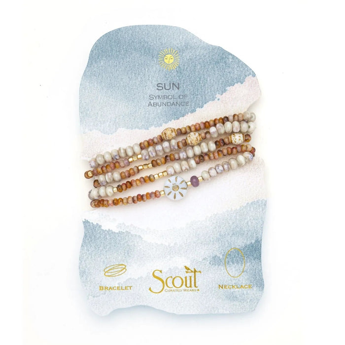 Scout Abundance/Sun ceramic bead wrap bracelet/necklace with cream, pink, amber, and lavender beads and a gold-tone sun motif.