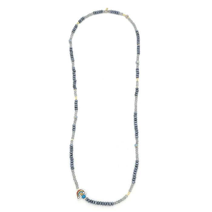 Scout Curated Wears Hope/Rainbow ceramic bead wrap bracelet and necklace with gray beads, gold-tone accents, and a colorful rainbow charm.