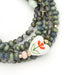 Scout Curated Wears Love/Heart ceramic bead convertible jewelry, wearable as a wrap bracelet or necklace.