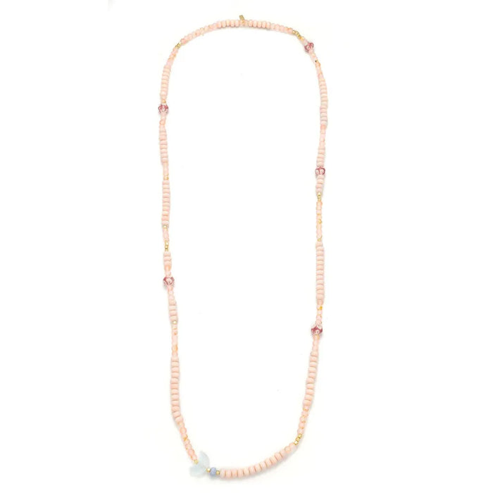 Scout Curated Wears pink beaded Balance/Moon bracelet and necklace on a display card reading “Moon, symbol of balance.