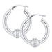 Silver hoop earrings with small diamonds on a white background