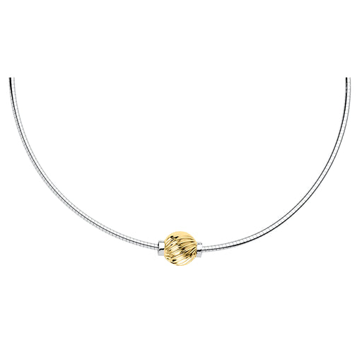 Gold bead on a silver necklace against a white background