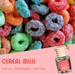 Colorful cereal-shaped candies with a bottle labeled 'Cereal Milk' on a pink background