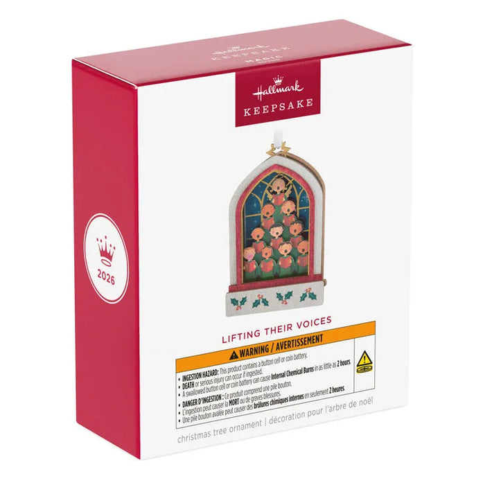 Hallmark 2026 Keepsake Ornament box side view showing red packaging, crown emblem, and safety warning label for Lifting Their Voices musical papercraft decoration