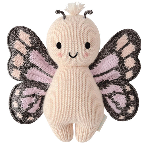 Cuddle + Kind Baby Butterfly in Peach – front view of handmade knit stuffed butterfly doll with smile and patterned wings.